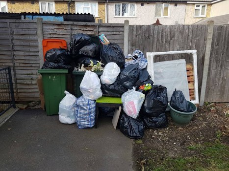 Demolition site in Wimbledon with waste removal trucks